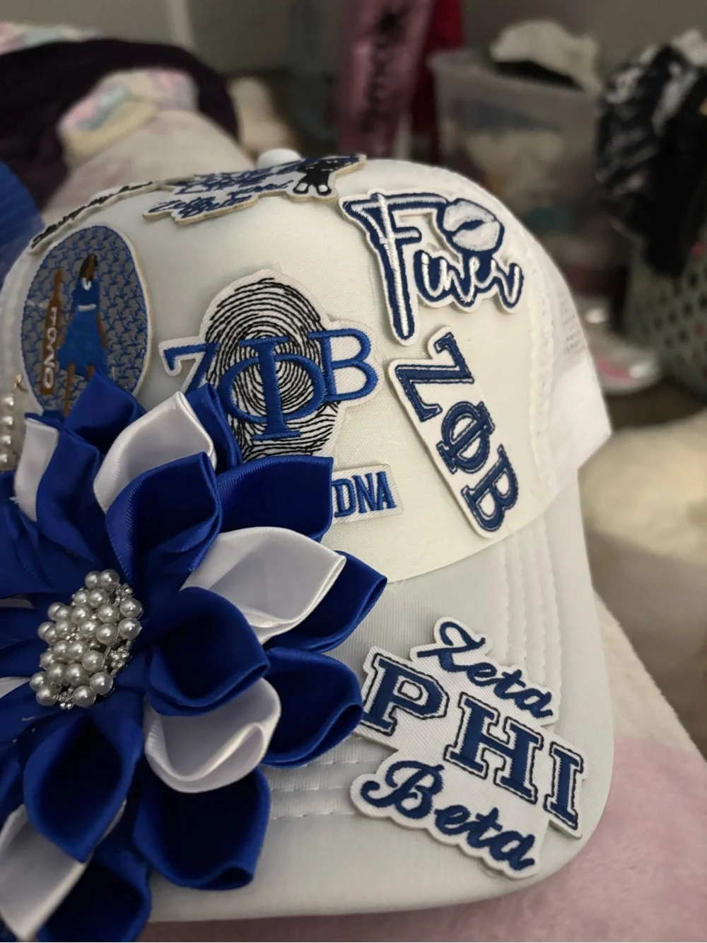 White Hat with Blue & White Flower Appliqué